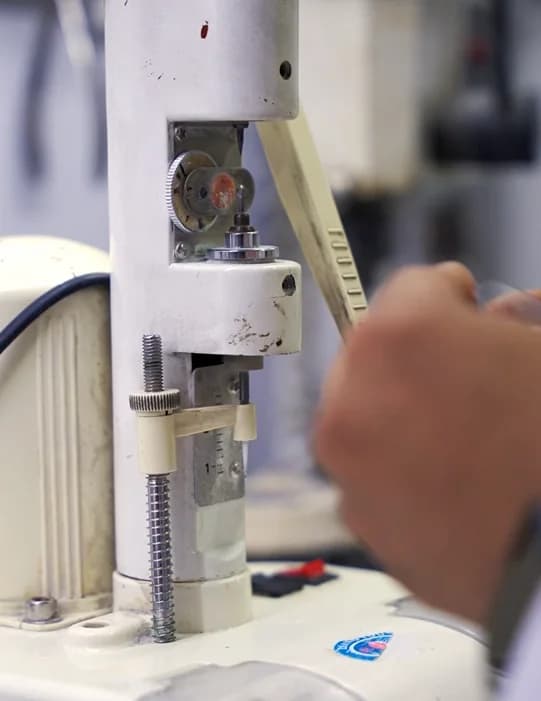 A lens being centred on the blocking machine